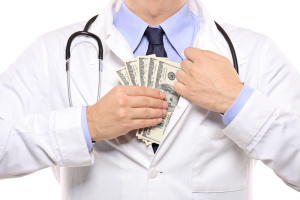 A doctor putting money in his pocket